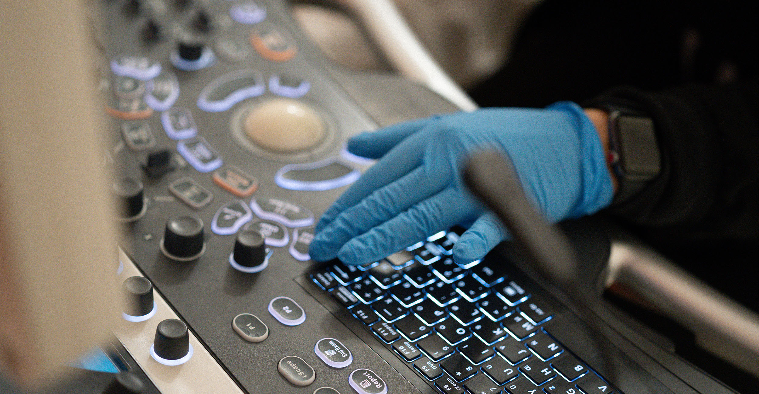 OneHealth Q&A banner Control panel of a sonogram machine