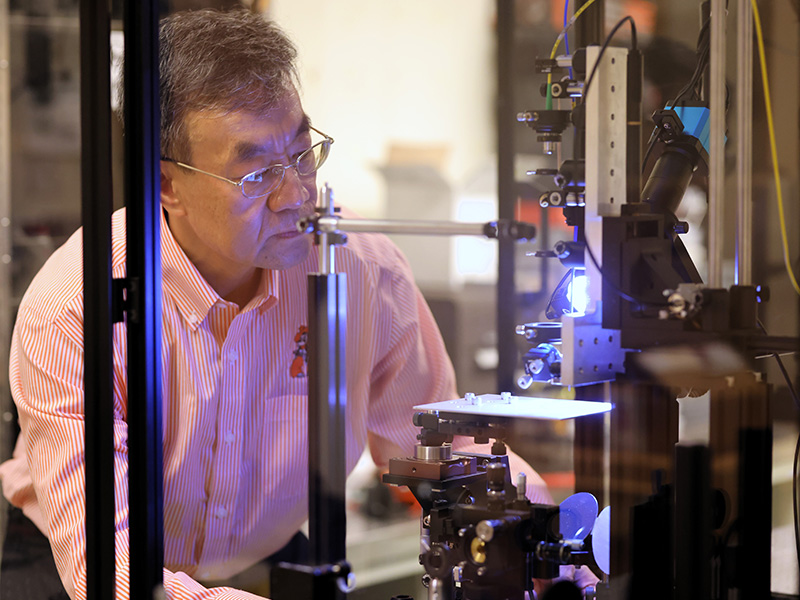 Dr. Weili Zhang conducts research in his lab. Dr. Weili Zhang conducts research in his lab.