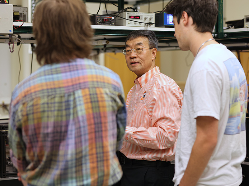 Dr. Weili Zhang mentors students in his research lab. Dr. Weili Zhang mentors students in his research lab.