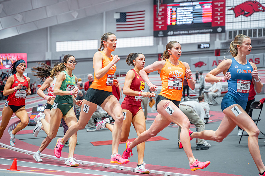 A group of athletes compete while running. A group of athletes compete while running.