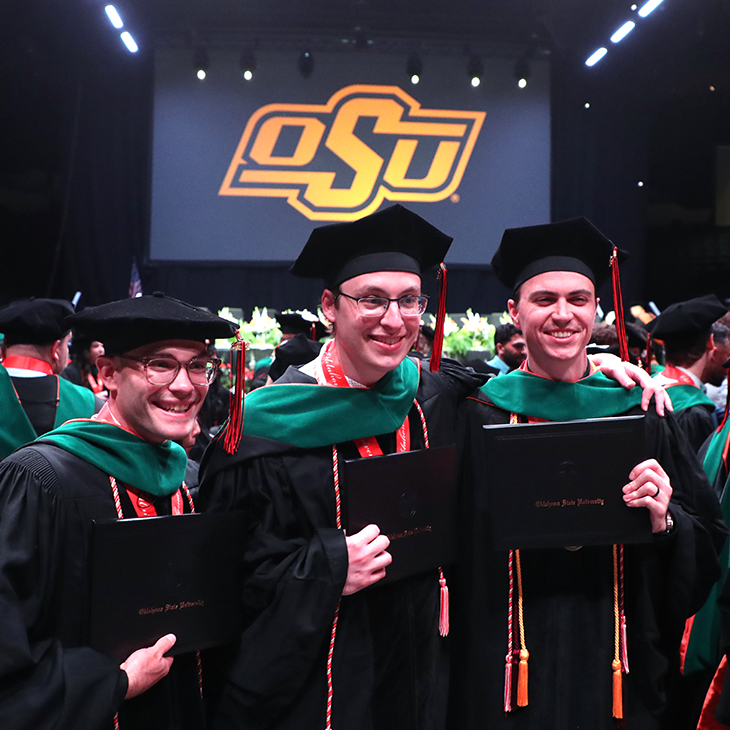 OSU-COM graduates take a photo following commencement ceremony OSU-COM graduates take a photo following commencement ceremony