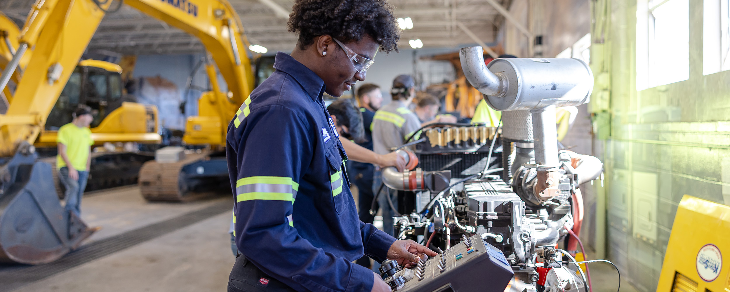 OSUIT student works on Komat'su console
