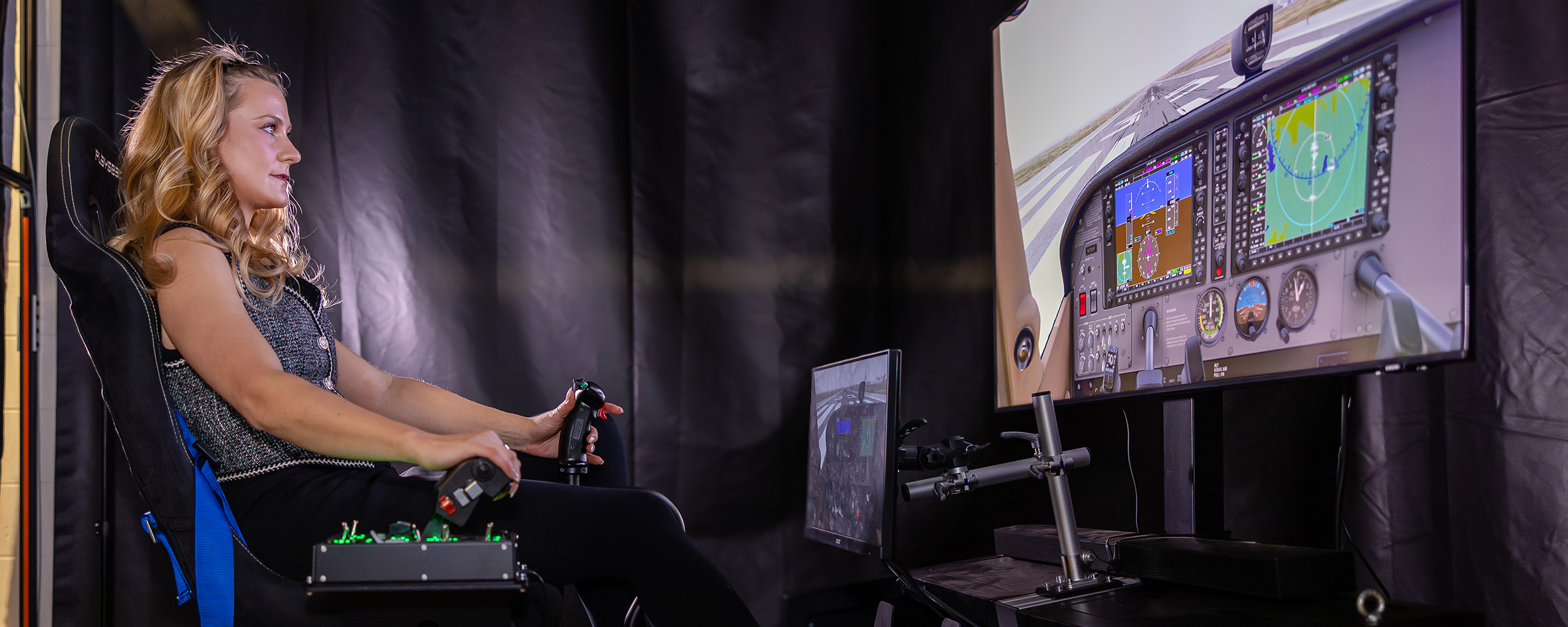 Ainsley Kyle testing flight sim equipment