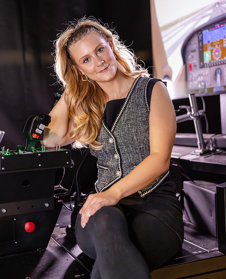 Ainsley Kyle in a room full of electronic equipment